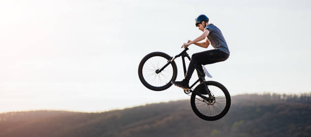 istock Young man flying through the air on a mountain bike 2040313191