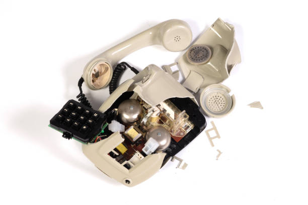 istock Part of a broken old telephone, phone with dial plate - plastic phone 2040322205
