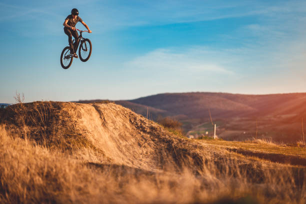 istock Young man on a mountain bike performing a dirt jump 2040329705