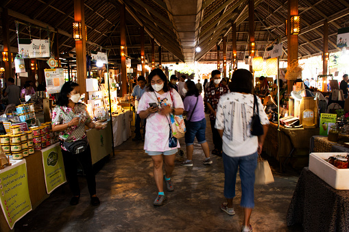 Local farmers organic market and street bazaar for thai people travelers travel visit select buy eat drink shopping products goods wisdom at Nakhonpathom on January 27, 2024 in Nakhon Pathom, Thailand