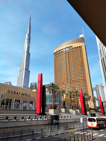Dubai, UAE - January 26, 2024: Dubai Mall main entrance and Burj Khalifa seen from a bus parking