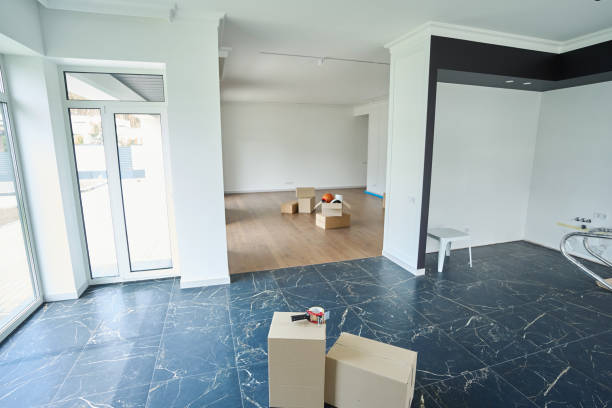 istock Modern townhouse with variety objects in cardboard boxes on floor in sunny day 2040363525
