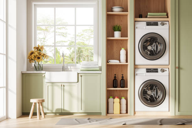 istock Laundry room interior with sink and washing machines, panoramic window 2040370377