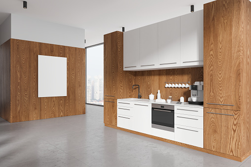 Wooden and white home kitchen interior with cabinet, side view shelves on light concrete floor, sink and oven. Panoramic window on skyscrapers. Mockup empty canvas poster. 3D rendering