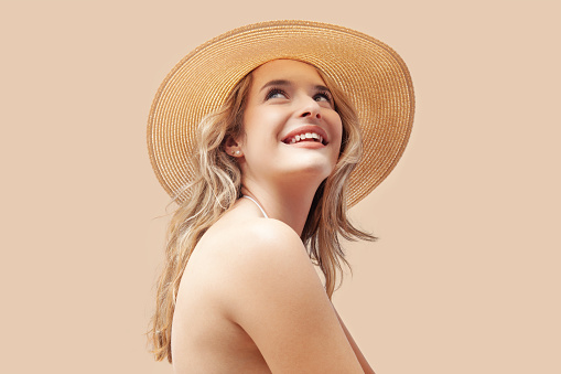 Candid Portrait, Woman with a happy natural smile wearing a Hat. Nikon D810. Converted from RAW.