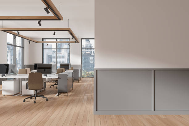 istock Office coworking interior with pc desktop and chairs in row, window. Mockup wall 2040386820