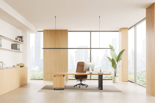 istock Modern office interior with work desk near window, pc desktop and sideboard 2040388262
