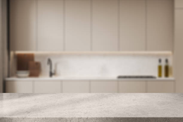 istock Stone countertop on background of kitchen interior with kitchenware. Mockup 2040403187