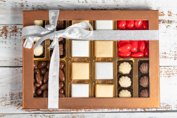 istock Packaged chocolate box. Pastry product. Gift chocolate box prepared with various chocolates on a white background. Top view 2040403738