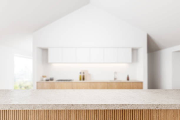 istock Empty quartz counter on background of kitchen interior with window. Mockup 2040405862