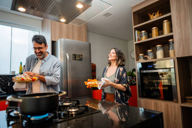 Mature couple cooking at home