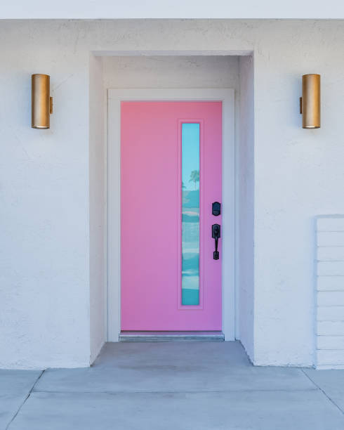 istock Pink door on a mid-century modern house 2040416234