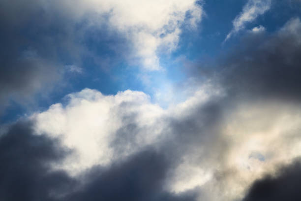 The wind tore the clouds in the sky, a gap through the clouds