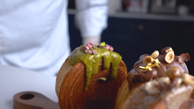 A French dessert chef adds pistachios to his New York Roll dessert