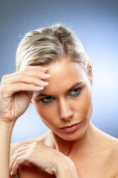 istock blond young woman with stunning blue eyes 2040428219