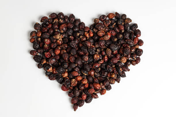 Dried rosehip fruit in the shape of a heart stock photo