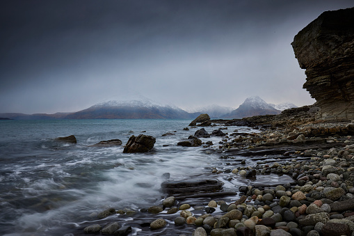 Elgol during storm in wintertime, Cuillins mountains are covered with snow.