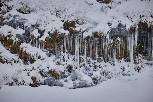 icicles over rocks in wintertime, Scotland