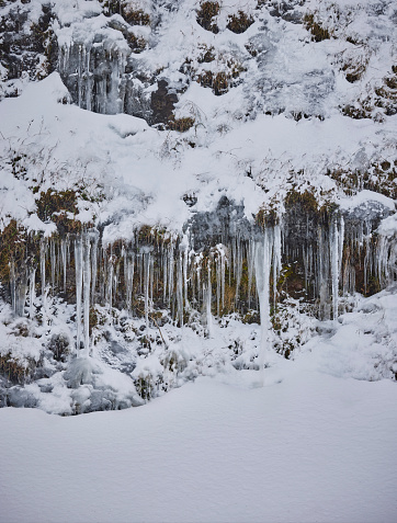 icicles over rocks in wintertime, Scotland