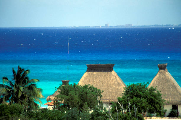 Coloful Mexican pottery and architecture on the beach in Cancun.
