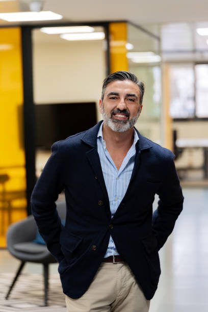 istock Smiling man in a blazer at the office. 2040512475