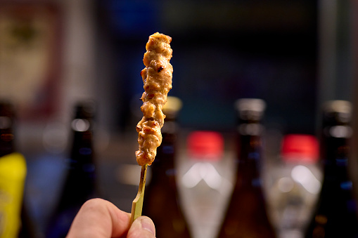 Yakitori, Japanese traditional grilled and charbroil chicken. Grilled and roast meat on plate on wooden table. Broiled barbecue seasoned chicken photo. Japanese style skewered chicken. Cooking, Restaurant, Japan, Tokyo.