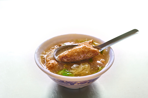 Taiwanese traditional famous and delicious street food in Taiwan, traditional cuisine in Taiwan. Close up of top view Chinese style food, usually can be founded in night market. Fried Spanish mackerel thick soup
