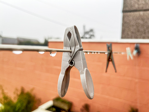 Pegs on clothesline rainy day