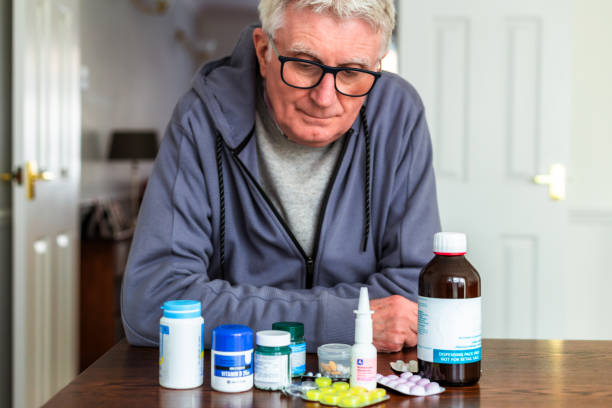 istock Senior man looking at his medication 2040580791
