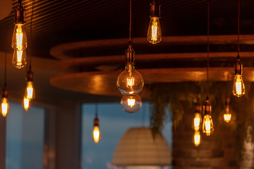 Decorative antique edison style filament light bulbs hanging from ceiling.