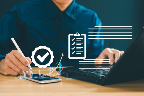 istock Business performance checklist Businessman uses computer to complete survey, online checklist, fill out digital checklist Evaluate questionnaires, evaluations, online surveys. online exam 2040597546