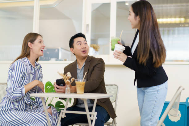 istock Businesspeople drinking a coffee together. 2040609329