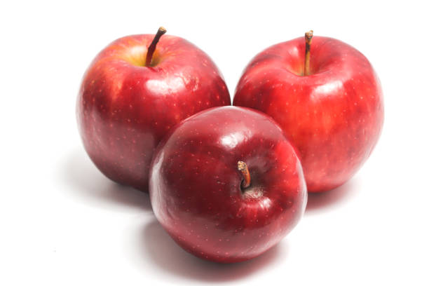 istock Three fresh organic red apple delicious fruit side view isolated on white background clipping path 2040641799