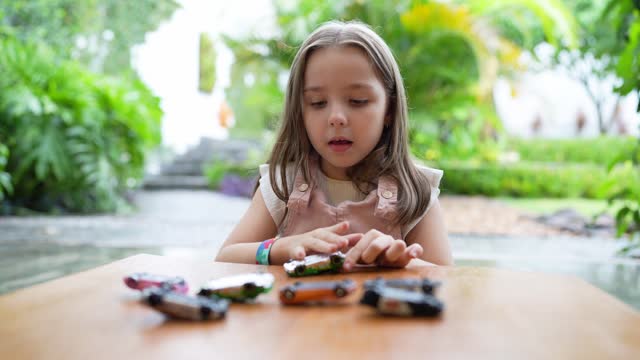 Autistic child playing with cars