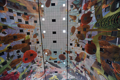 The Markthal (Market Hall) is a residential and office building with a market hall underneath, located in Rotterdam. The building was opened on October 1, 2014 planned by  MVRDV architects. The image shows the beautiful ceiling inside the hall.