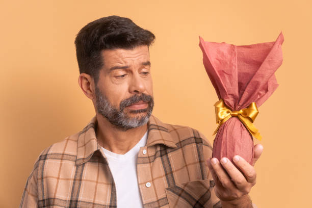 istock worried brazilian man looking at easter egg 2040650275