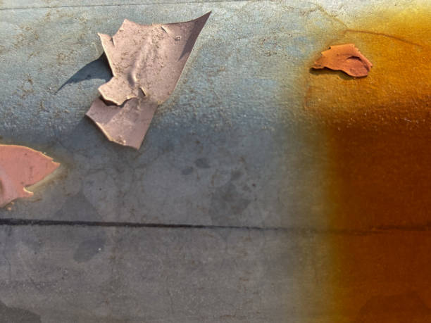 abstract background with peeling paint on a rusty metal surface - paint lead peeling peeled imagens e fotografias de stock