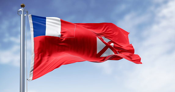 National flag of Wallis and Futuna waving on a clear day. French overseas collectivity in the South Pacific. 3d illustration render. Rippling fabric