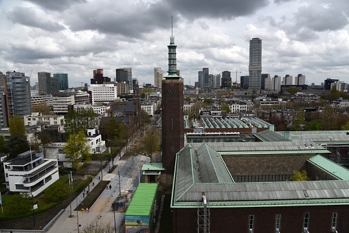 The Skyline of Rotterdam City captured on a cloudy day during spring season seen from the roof of the Depot Boijmans Van Beuningen.