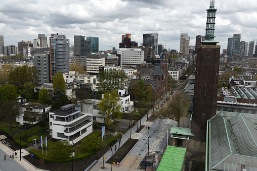 The Skyline of Rotterdam City captured on a cloudy day during spring season seen from the roof of the Depot Boijmans Van Beuningen.