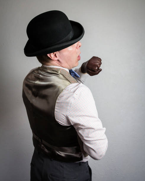 Vintage Ruffian in Bowler Hat and Waistcoat Punching Himself in the Face