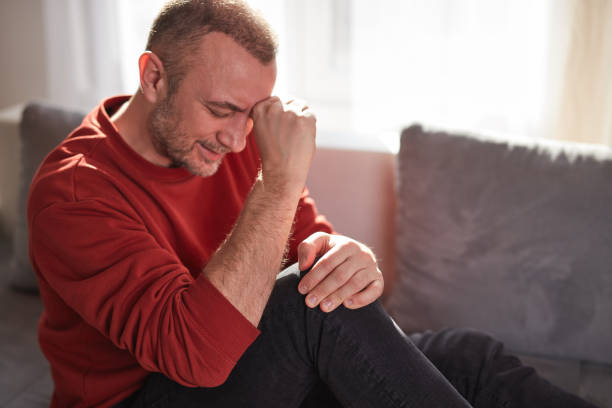 istock Man with knee pain at home. 2040699463