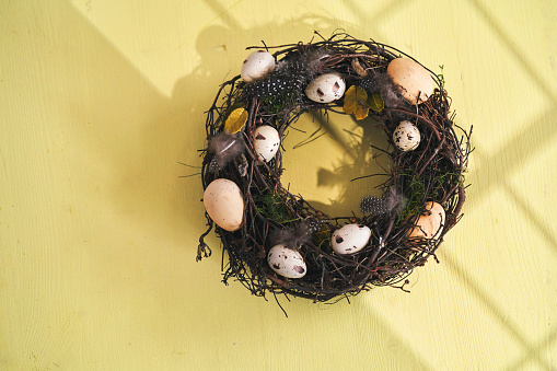 Easter Decoration with Easter Wreath and Eggs on Vibrant Background