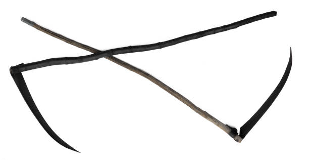 old scythe with black blade isolated on white background