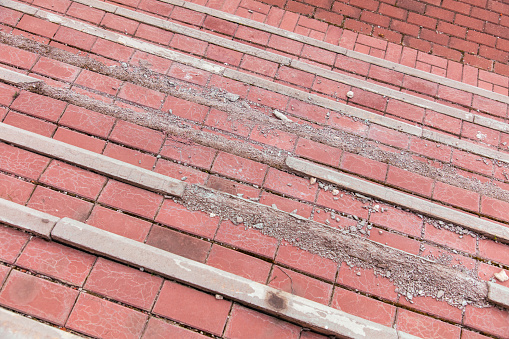 Broken red brick stairs in the city, abstract background for design.