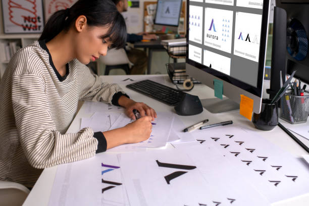 istock Asian Graphic designer working in office. Designing logo Artist Creative Designer Illustrator Graphic Skill Concept. 2040726592