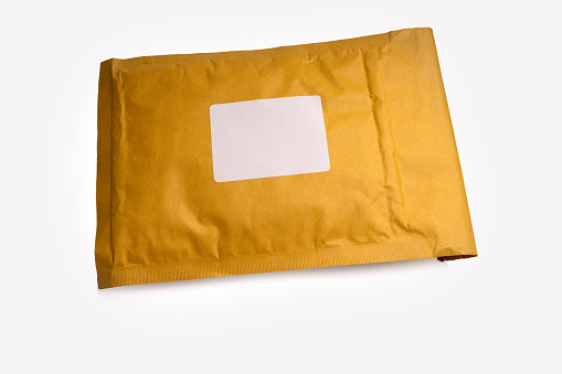 brown paper padded postal envelopes isolated on a white background with blank address label