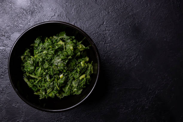 istock Boiled chard in a bowl on a dark background. 2040745419