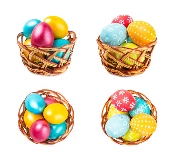 Easter basket filled with colorful eggs isolated on white background. Easter celebration concept. Colorful easter handmade decorated Easter eggs.
