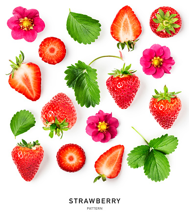 Fresh strawberry fruit, pink flower and leaf pattern isolated on white background. Creative layout. Healthy eating and food concept. Springtime concept. Top view, flat lay. Design element